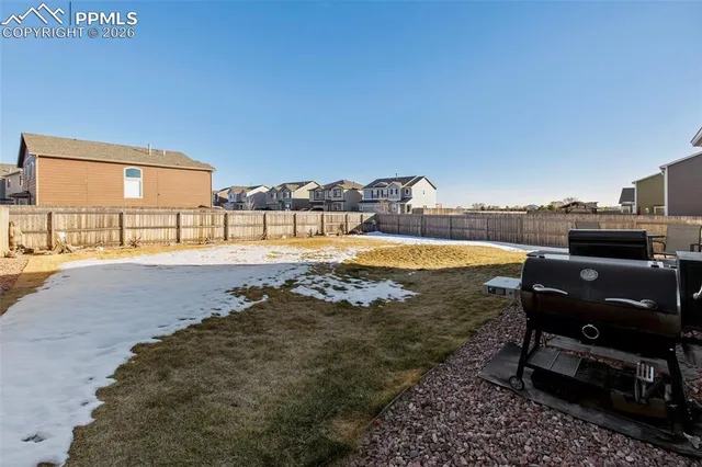 a view of a swimming pool with an outdoor seating