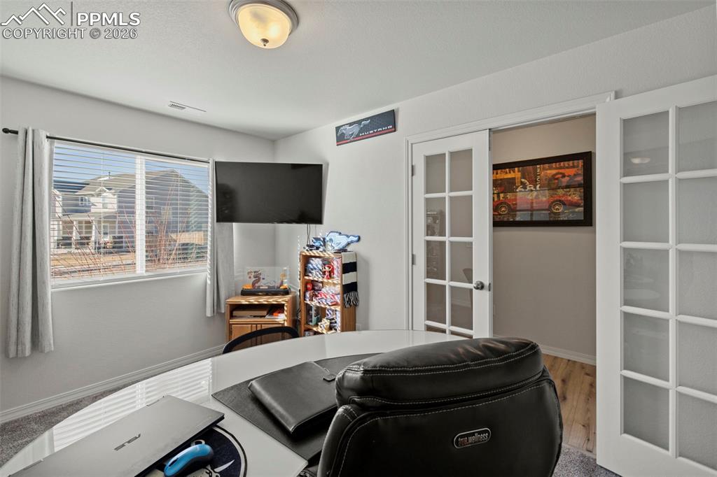 8151 Berwyn Loop Peyton, CO 80831 - Photo 4 of 39 a room with furniture and a window