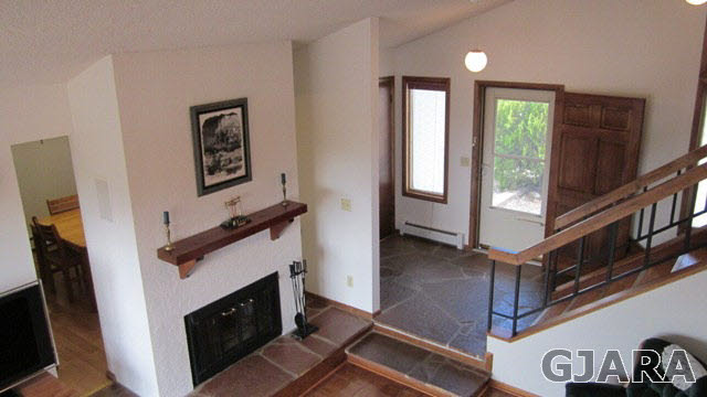2380 K Road Grand Junction, CO 81505 - Photo 3 of 27 a view of an entryway and hall with wooden floor