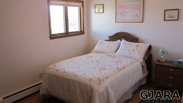 2380 K Road Grand Junction, CO 81505 - Photo 9 of 27 a bedroom with a bed and a window