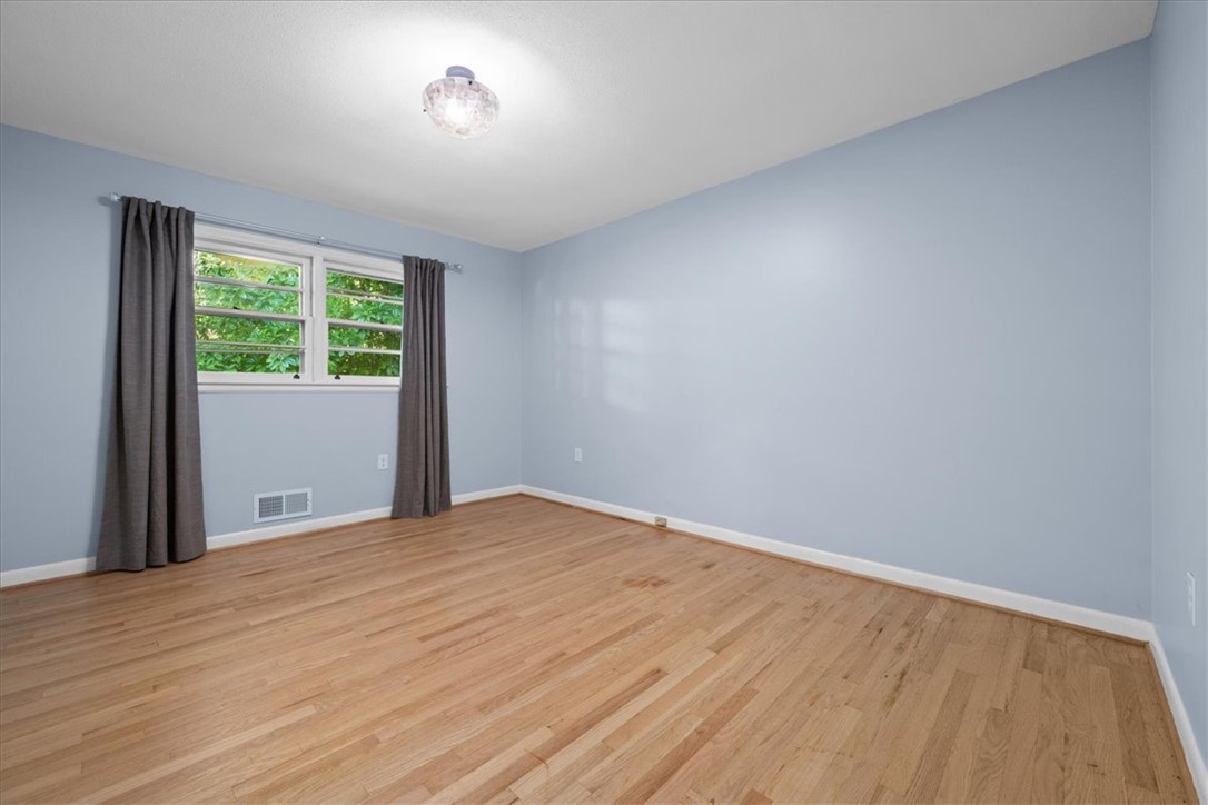 103 Satula Lane Clemson, SC 29631 - Photo 21 of 50 This spacious room features ample natural light and durable flooring, offering a comfortable living space.