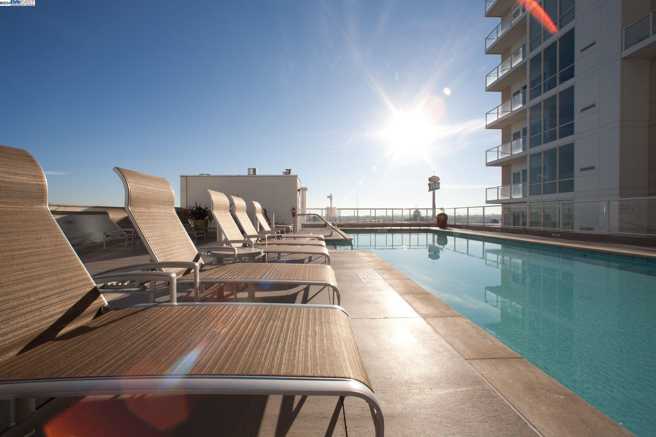 222 Broadway, Unit 1106 Oakland, CA 94607 - Photo 1 of 22 a view of a balcony with chairs