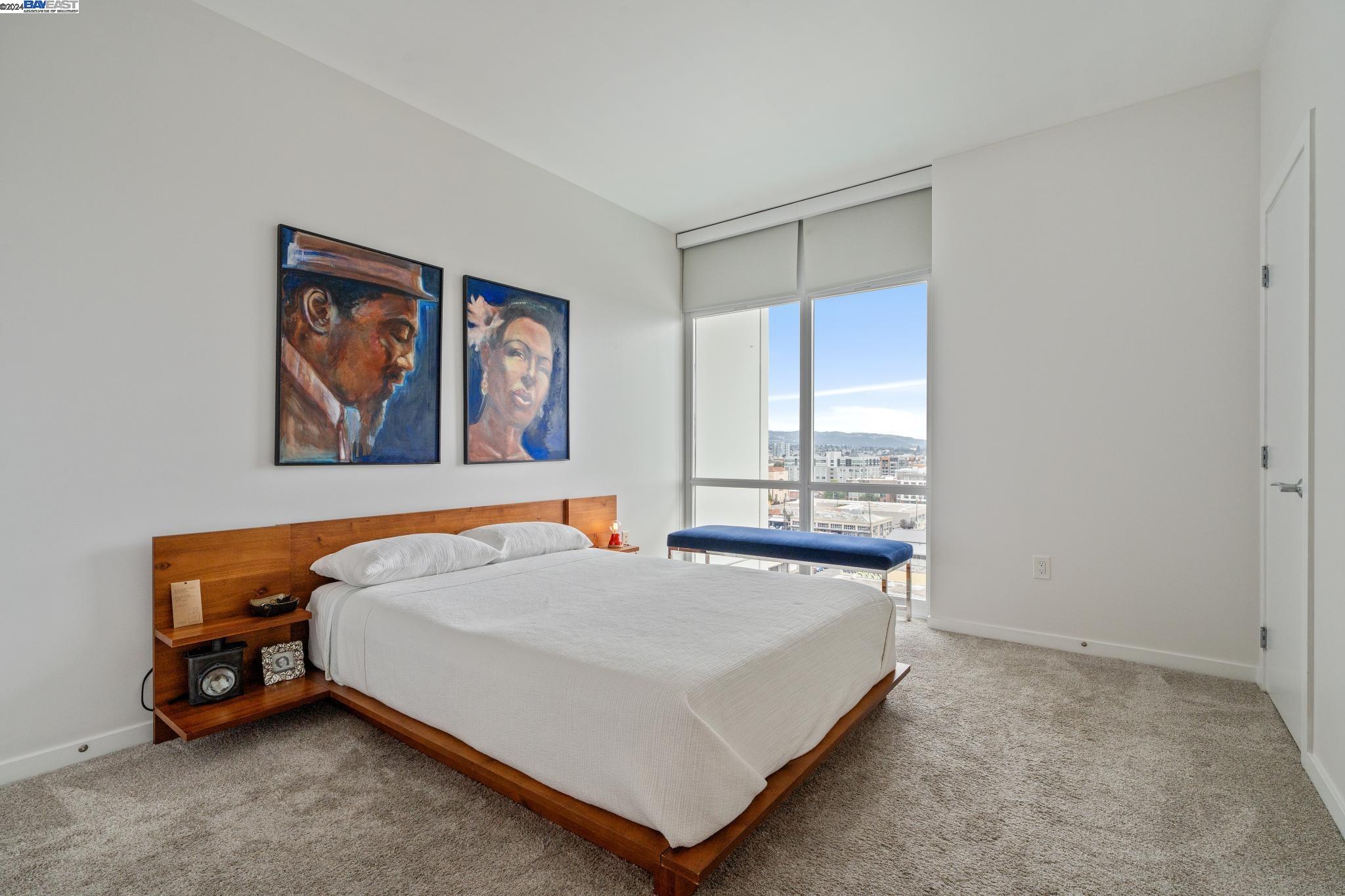 222 Broadway, Unit 1106 Oakland, CA 94607 - Photo 12 of 22 a bedroom with a bed and a window
