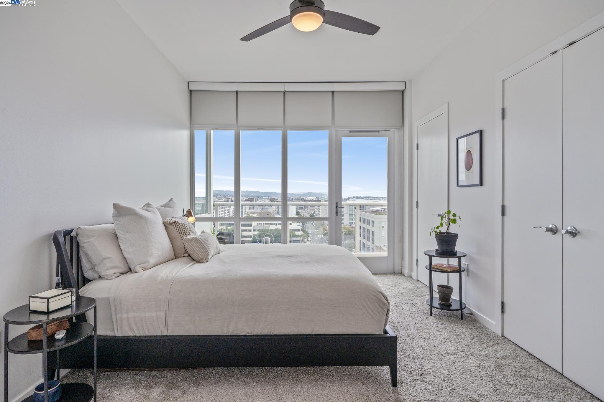 222 Broadway, Unit 1106 Oakland, CA 94607 - Photo 2 of 22 a bedroom with a bed and window