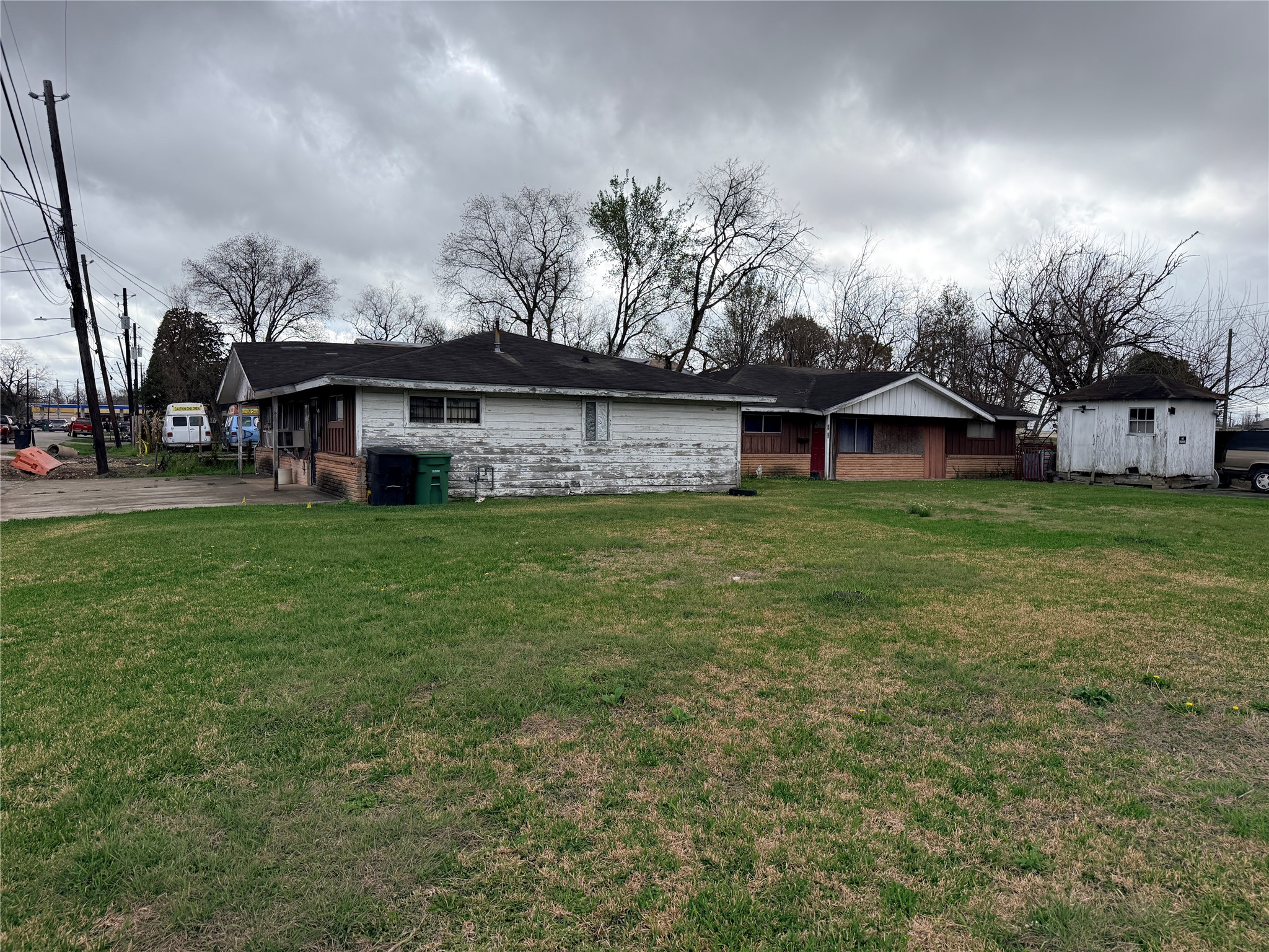 3804 Good Hope Street Houston, TX 77021 - Photo 3 of 7 a view of a house with a big yard and large trees