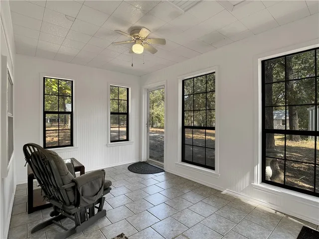 a living room with furniture and window