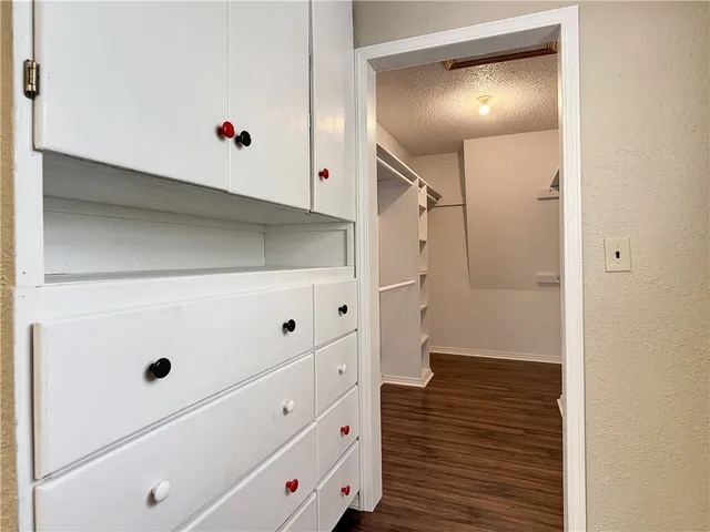 a view of an empty walk in closet