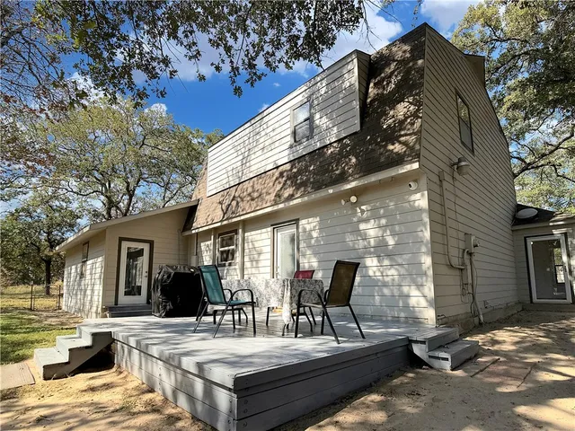 a view of house with outdoor seating space