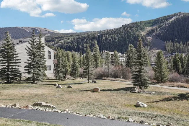 a view of a road with a building in the background