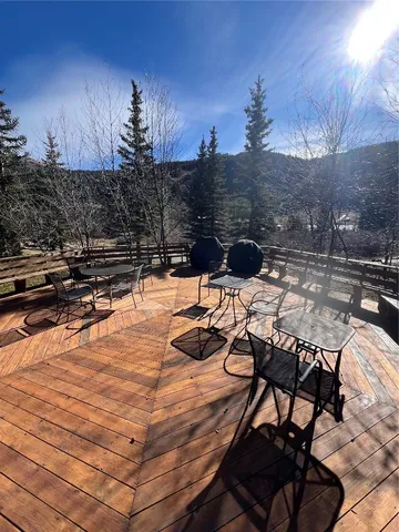 a view of a terrace with chairs and fire pit