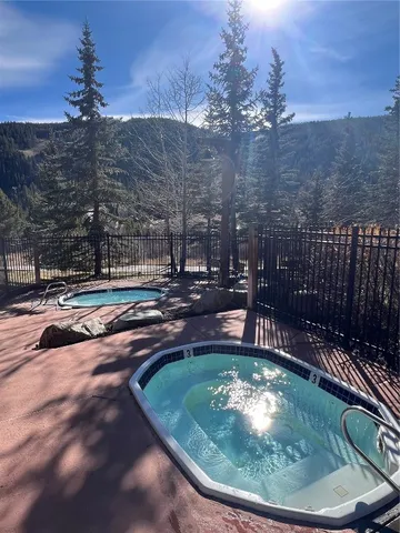 a view of swimming pool from a balcony
