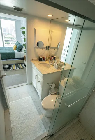 a bathroom with a sink mirror and a bathtub