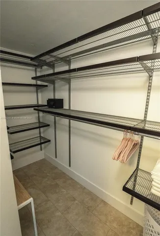 a view of a room with racks on the wall