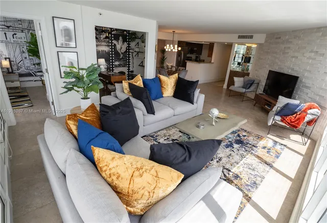 a living room with furniture and flat screen tv