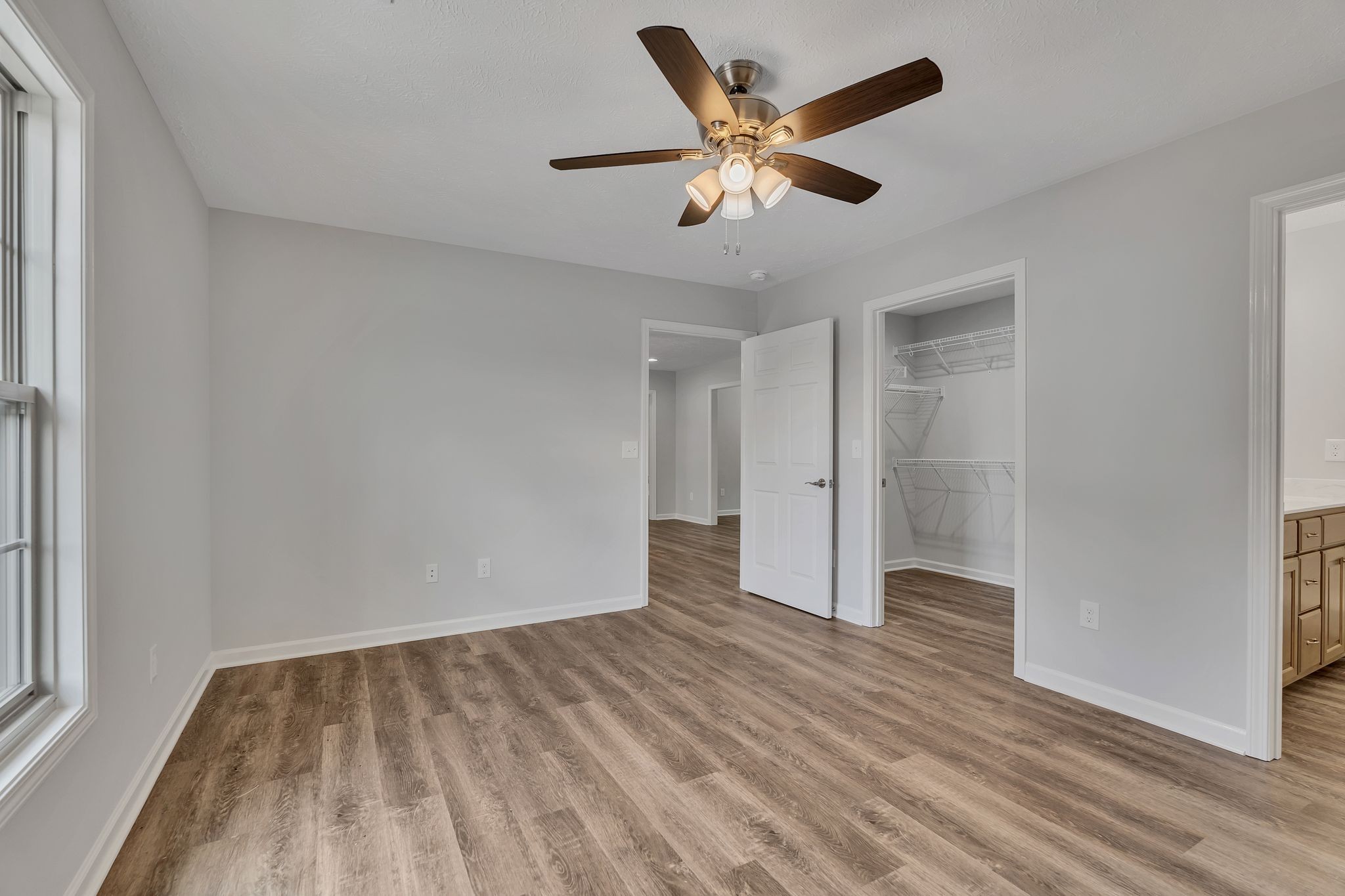 393 Flowertown Road Normandy, TN 37360 - Photo 21 of 34 an empty room with wooden floor and windows