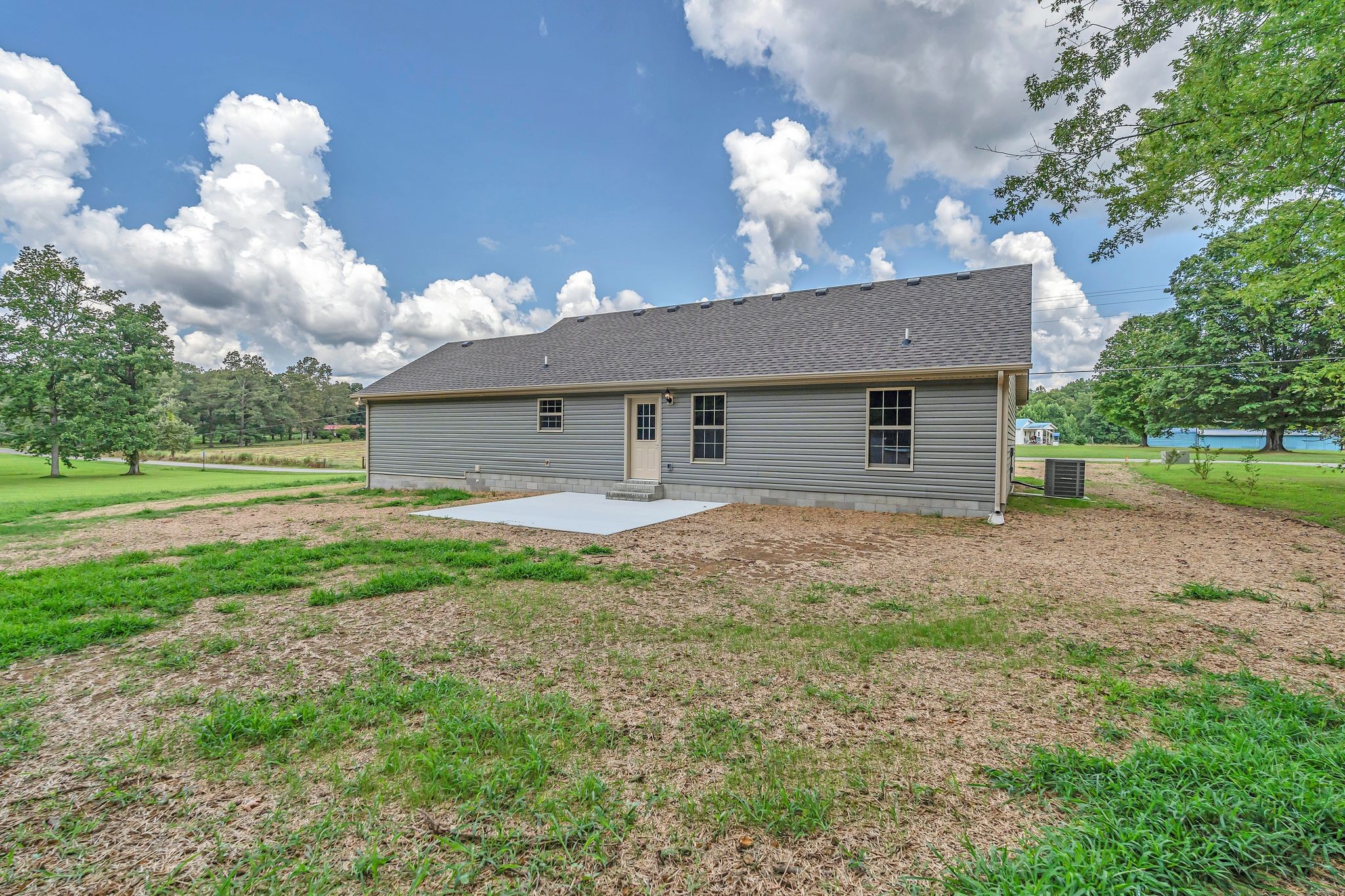 393 Flowertown Road Normandy, TN 37360 - Photo 34 of 34 a view of a house with backyard and a garden