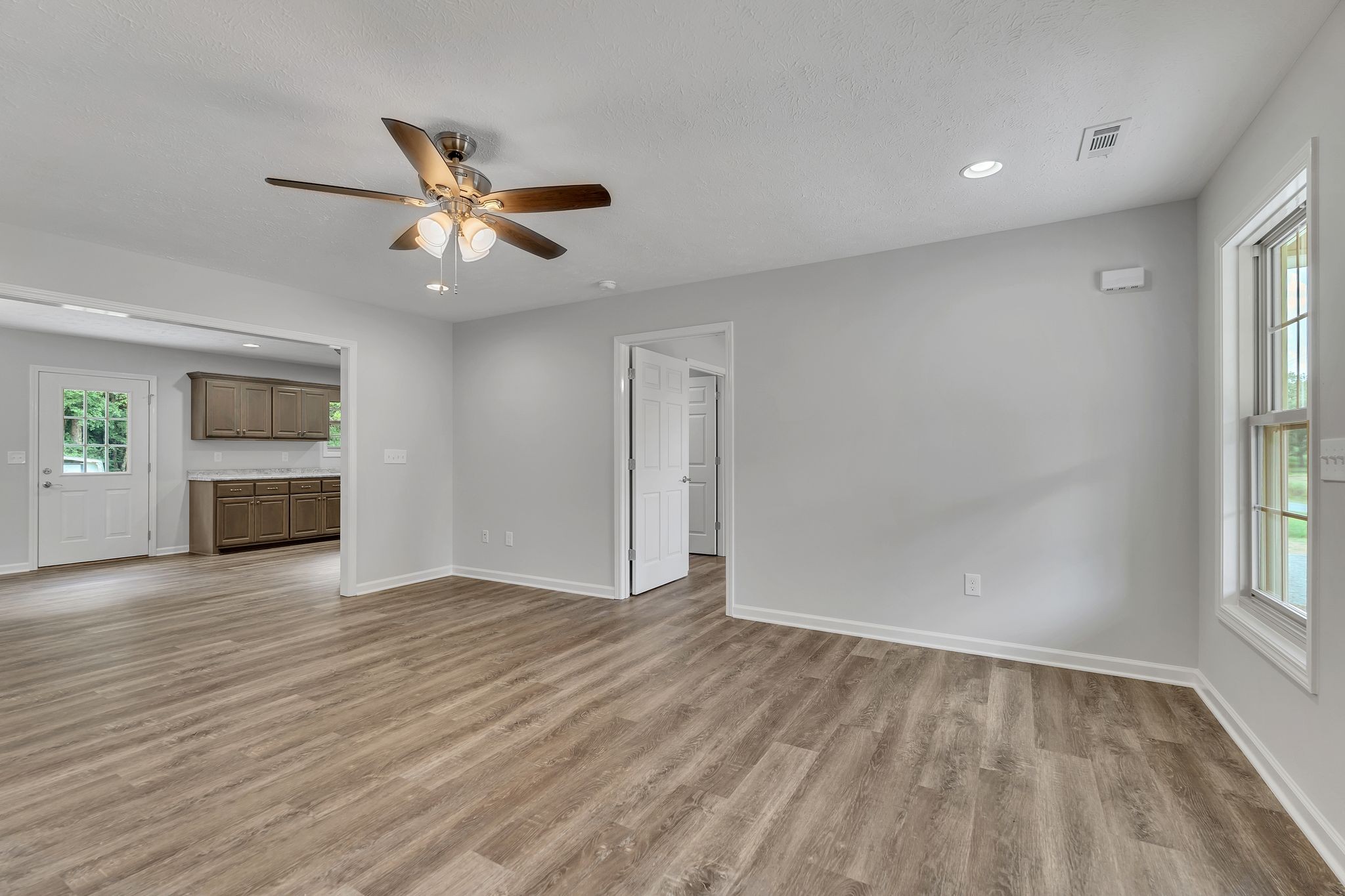 393 Flowertown Road Normandy, TN 37360 - Photo 8 of 34 wooden floor in an empty room with a window
