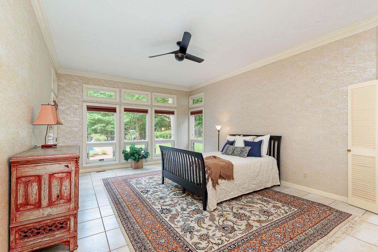212 Carpathian Way Raleigh, NC 27615 - Photo 14 of 31 Large master bedroom with impressive windows and door leading to patio Master Bedroom