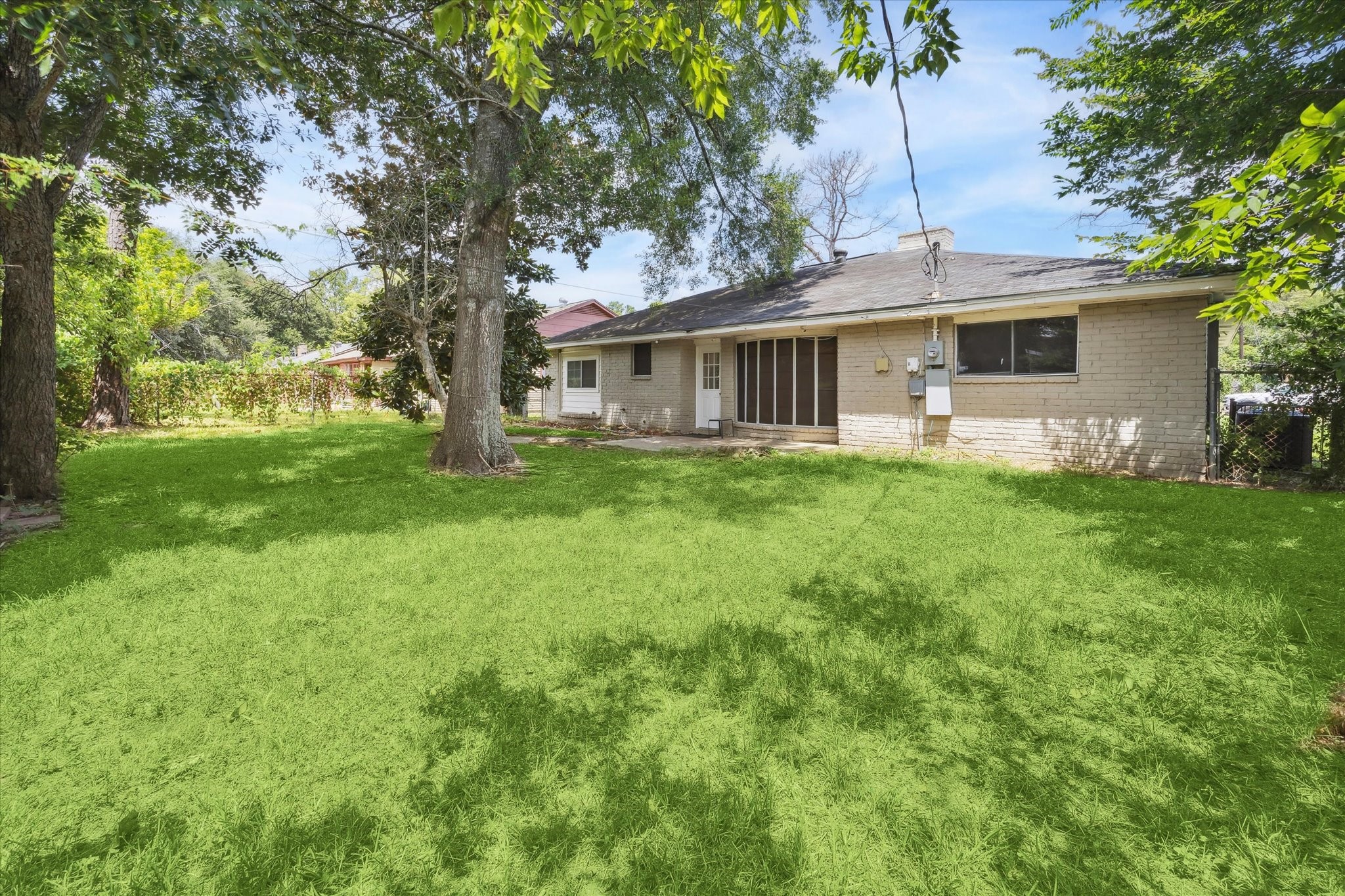 4731 Brookston Street Houston, TX 77045 - Photo 12 of 13 a front view of house with yard and green space