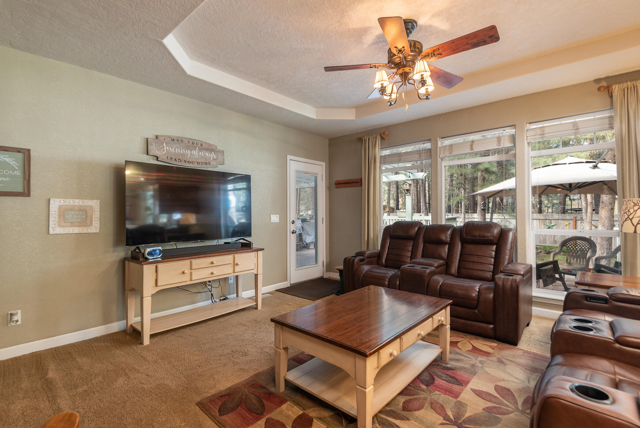 60055 Hopi Road Bend, OR 97702 - Photo 16 of 37 a living room with furniture and a flat screen tv
