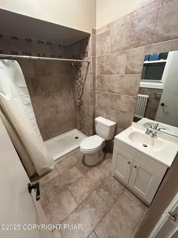 a bathroom with a sink and toilet