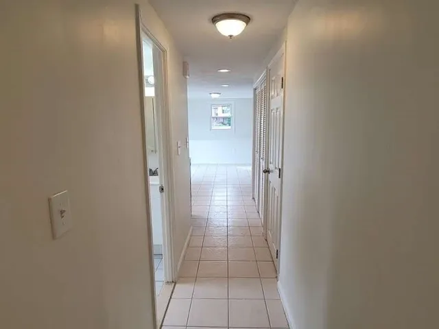 a bathroom with a shower and a glass door