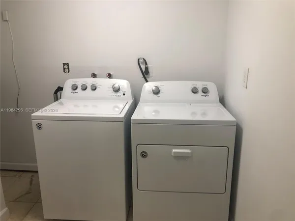 a utility room with dryer and washer