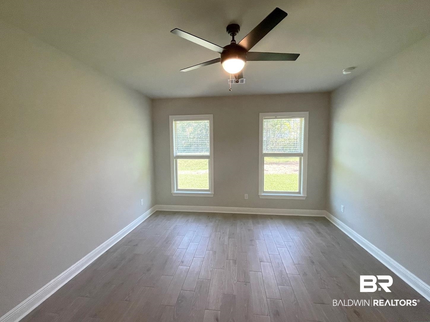 1428 Fenton Circle Foley, AL 36535 - Photo 6 of 15 Spare room featuring ceiling fan and light wood-type flooring