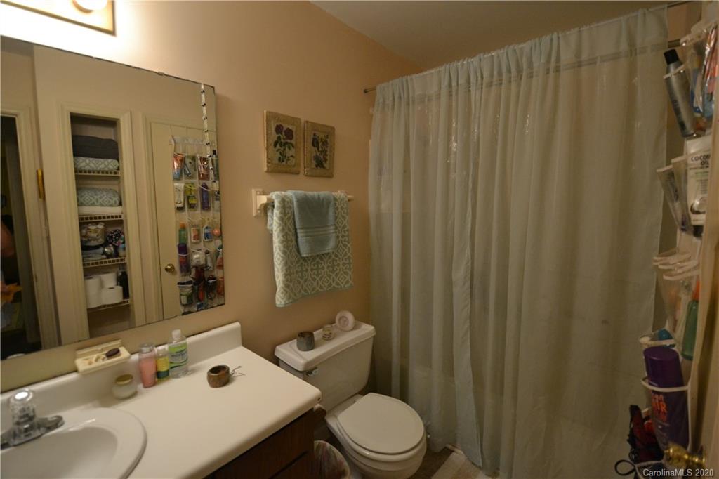2343 Roland Drive, Unit C Monroe, NC 28110 - Photo 13 of 15 a bathroom with a sink toilet and shower