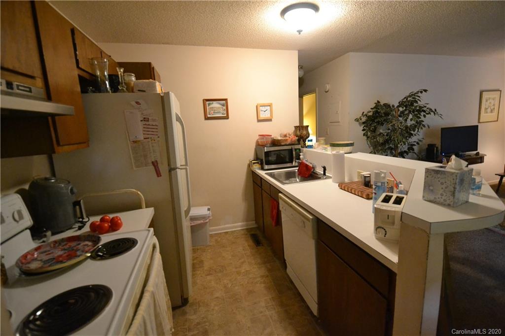 2343 Roland Drive, Unit C Monroe, NC 28110 - Photo 4 of 15 a kitchen with a sink stove and refrigerator