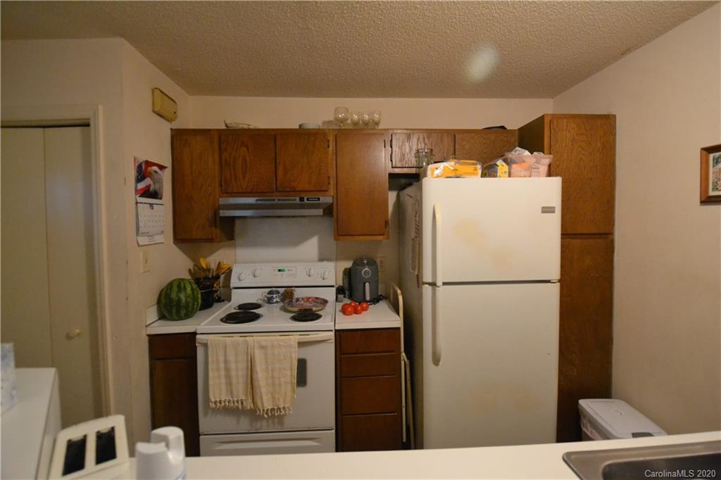 2343 Roland Drive, Unit C Monroe, NC 28110 - Photo 5 of 15 a white refrigerator freezer sitting in a kitchen
