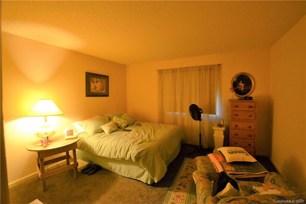 2343 Roland Drive, Unit C Monroe, NC 28110 - Photo 9 of 15 a bedroom with two beds and painted walls