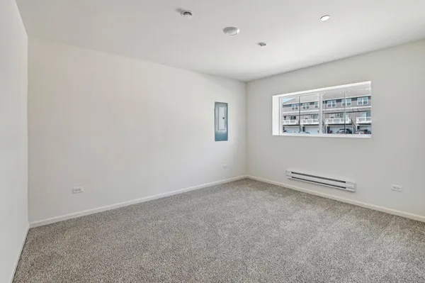 an empty room with a empty space and a window