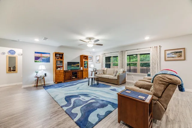 a living room with furniture and window