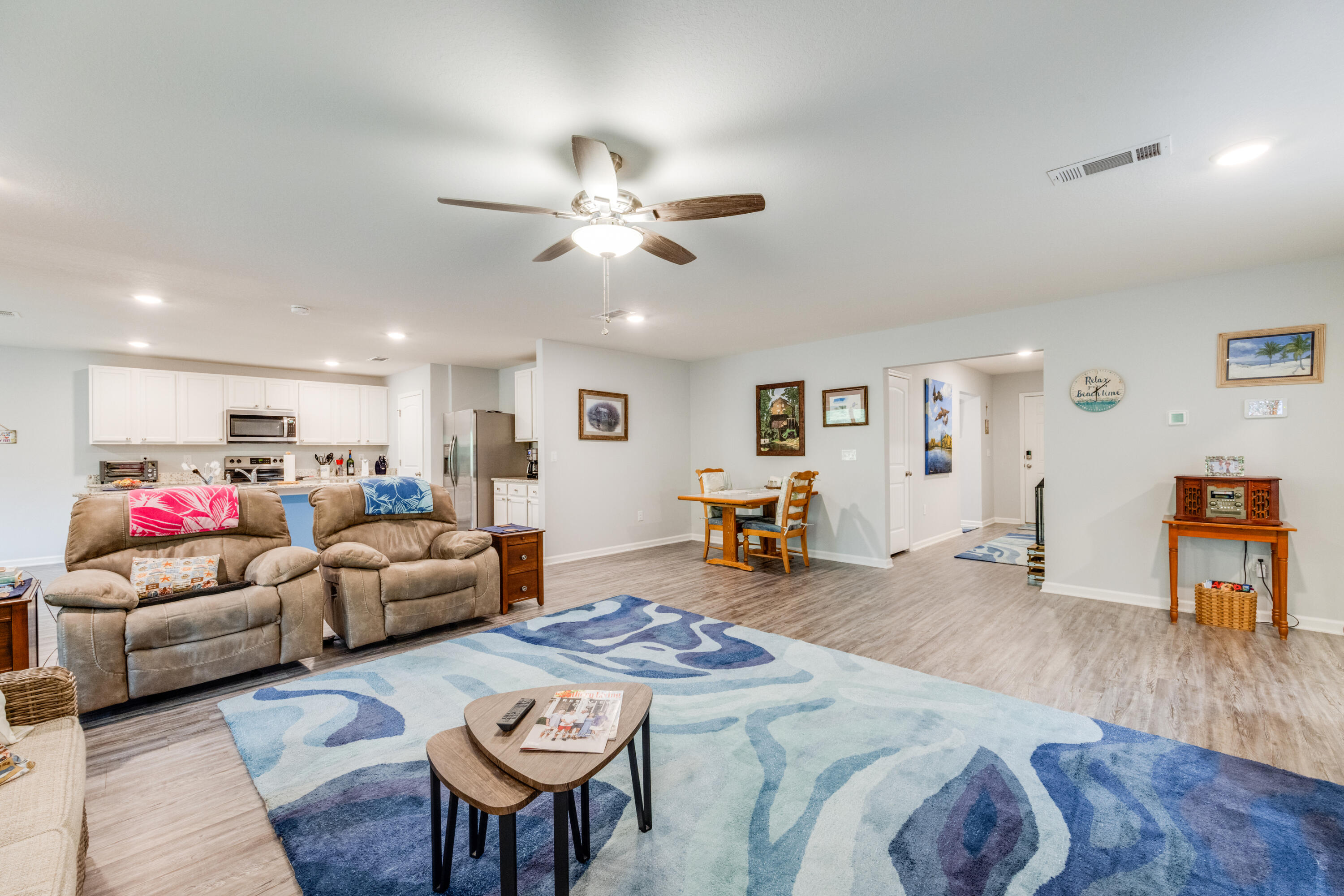 340 Merlin Court Crestview, FL 32539 - Photo 11 of 63 a living room with furniture and a wooden floor
