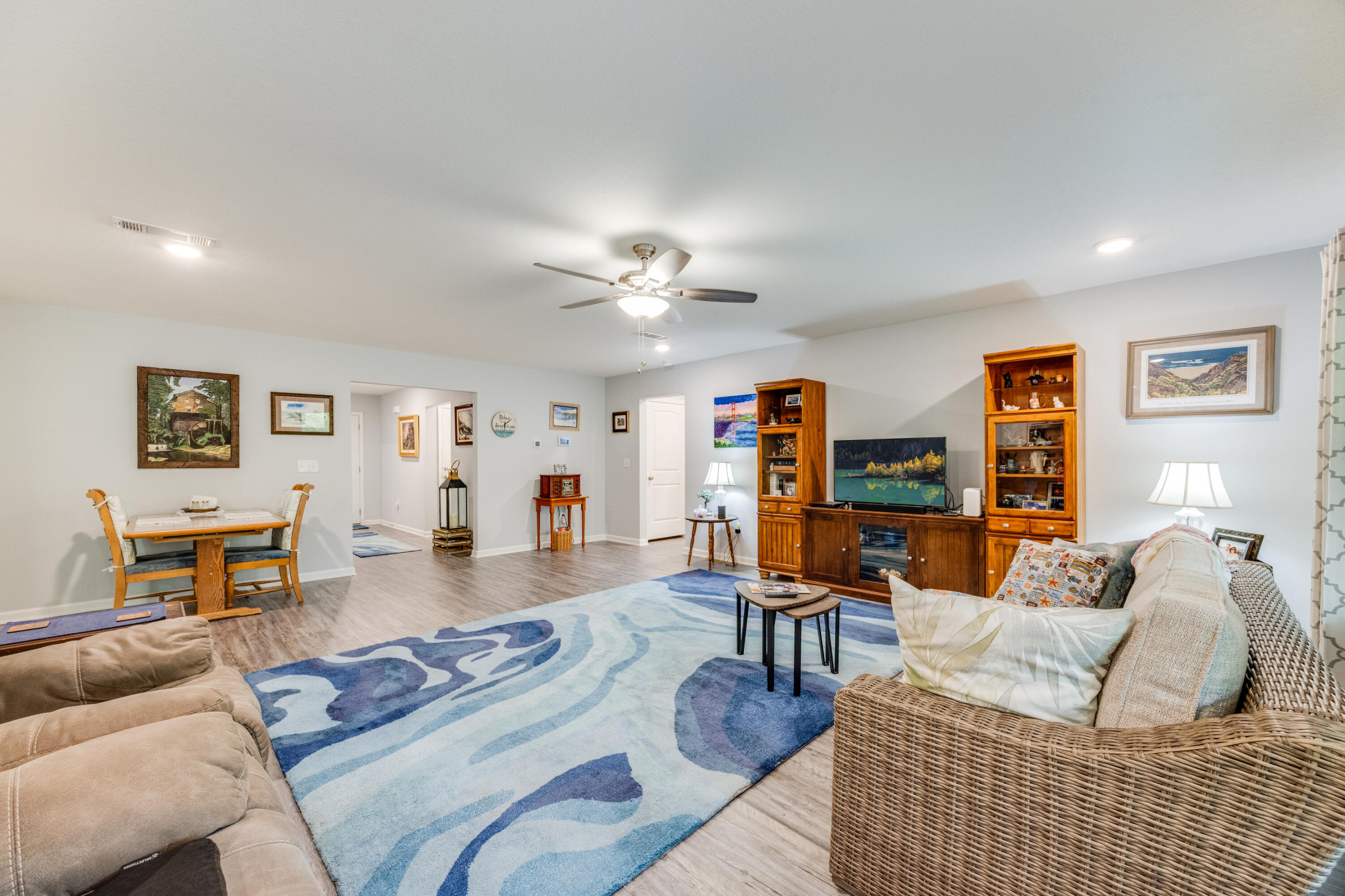 340 Merlin Court Crestview, FL 32539 - Photo 12 of 63 a living room with furniture and wooden floor