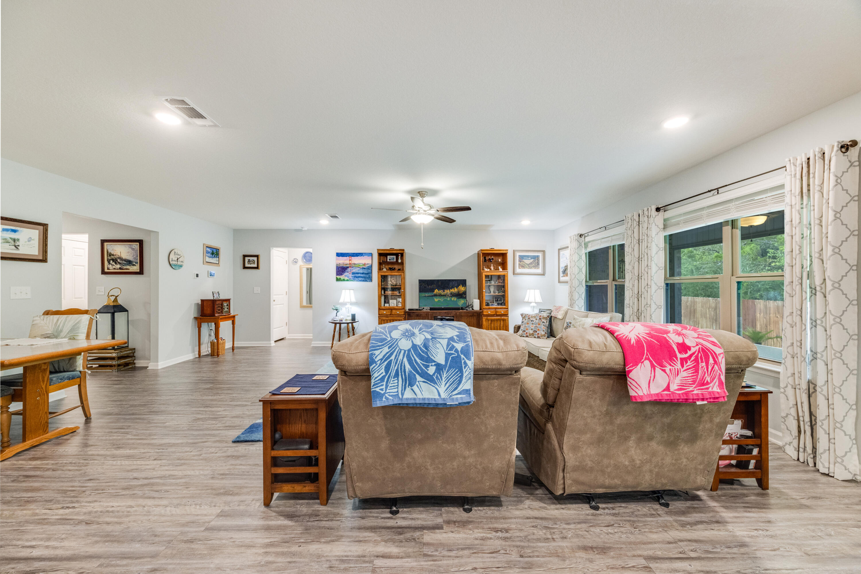 340 Merlin Court Crestview, FL 32539 - Photo 13 of 63 a living room with furniture and wooden floor