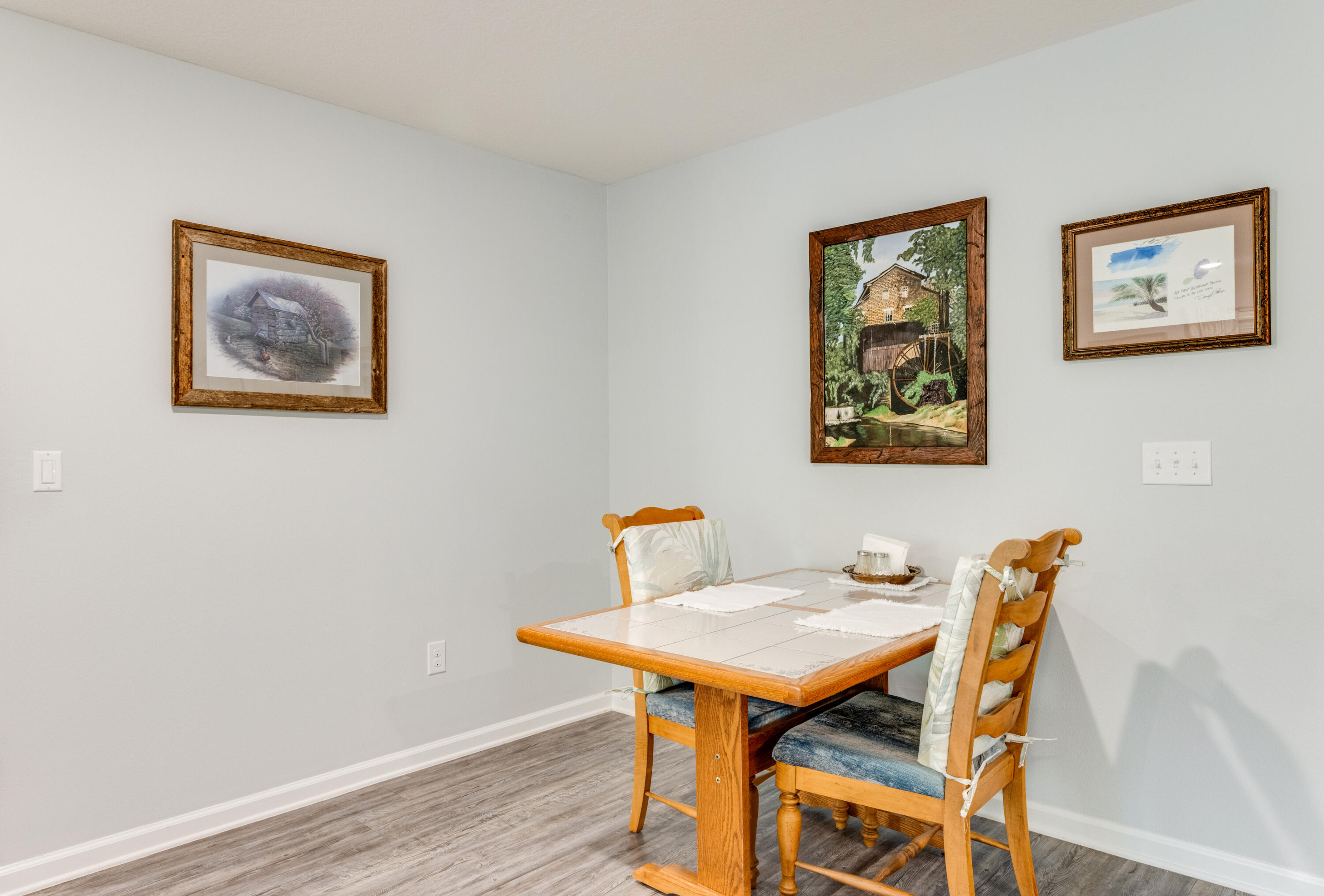 340 Merlin Court Crestview, FL 32539 - Photo 15 of 63 a view of a dining room with furniture and wooden floor
