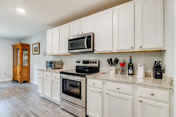 a view of a livingroom with furniture and a window