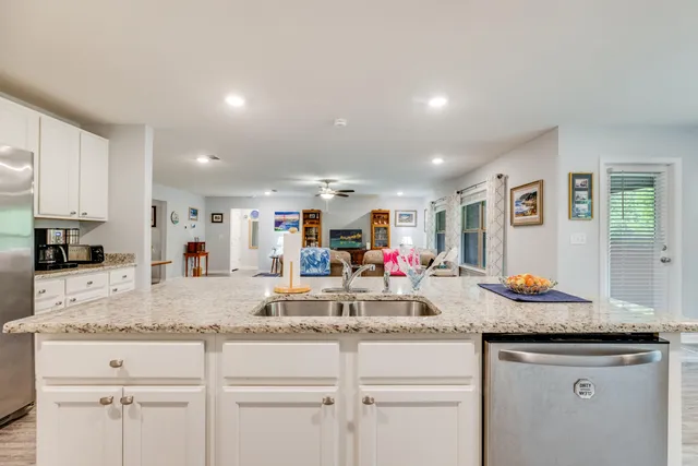 a room with wooden floor and windows