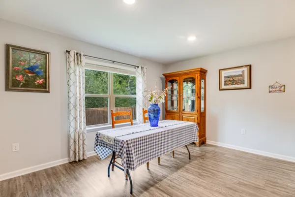 a view of a hallway with closet and a livingroom view