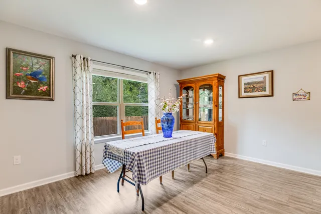 a bathroom with a shower a toilet and a sink