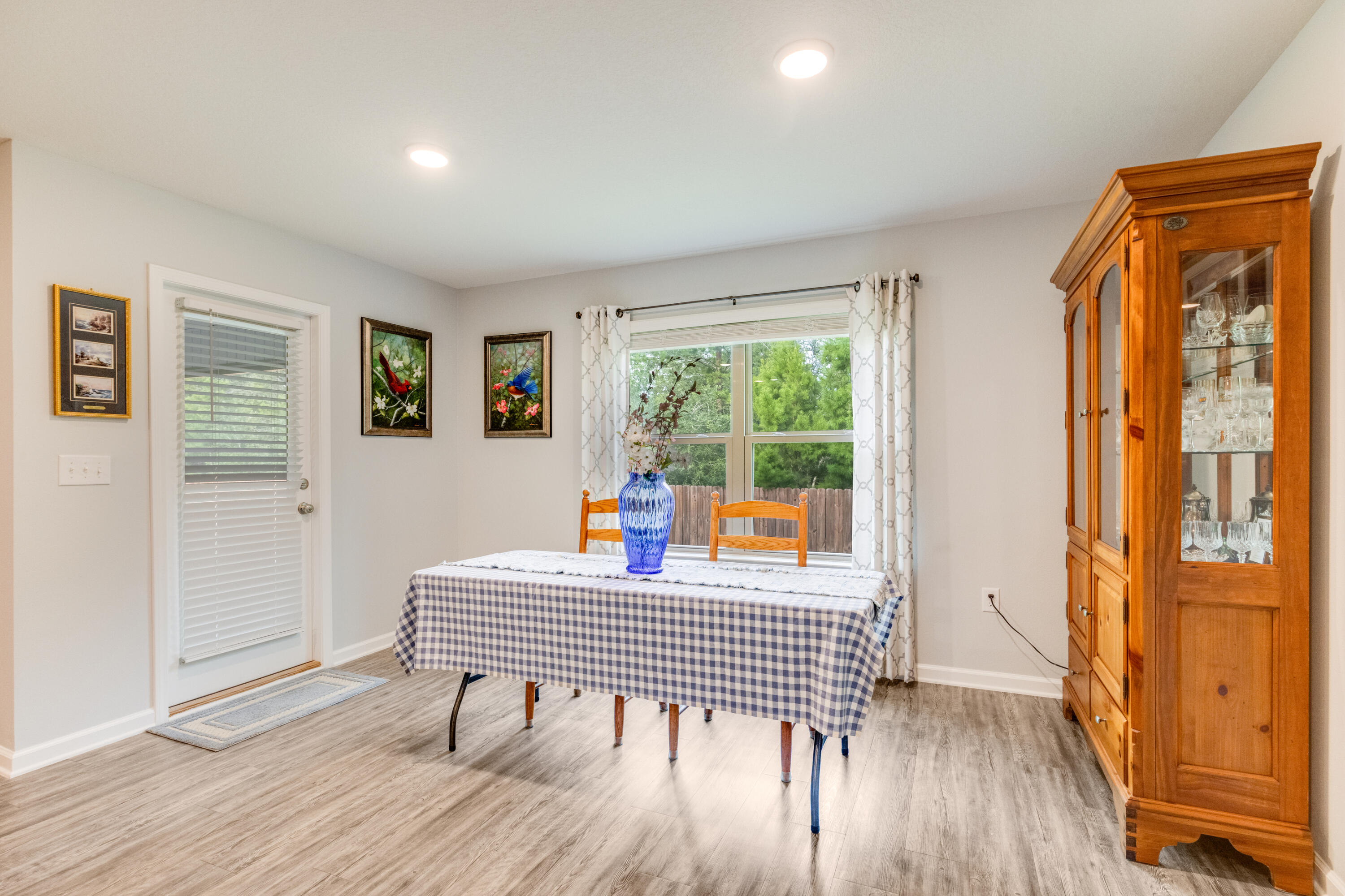 340 Merlin Court Crestview, FL 32539 - Photo 25 of 63 a room with wooden floor and windows