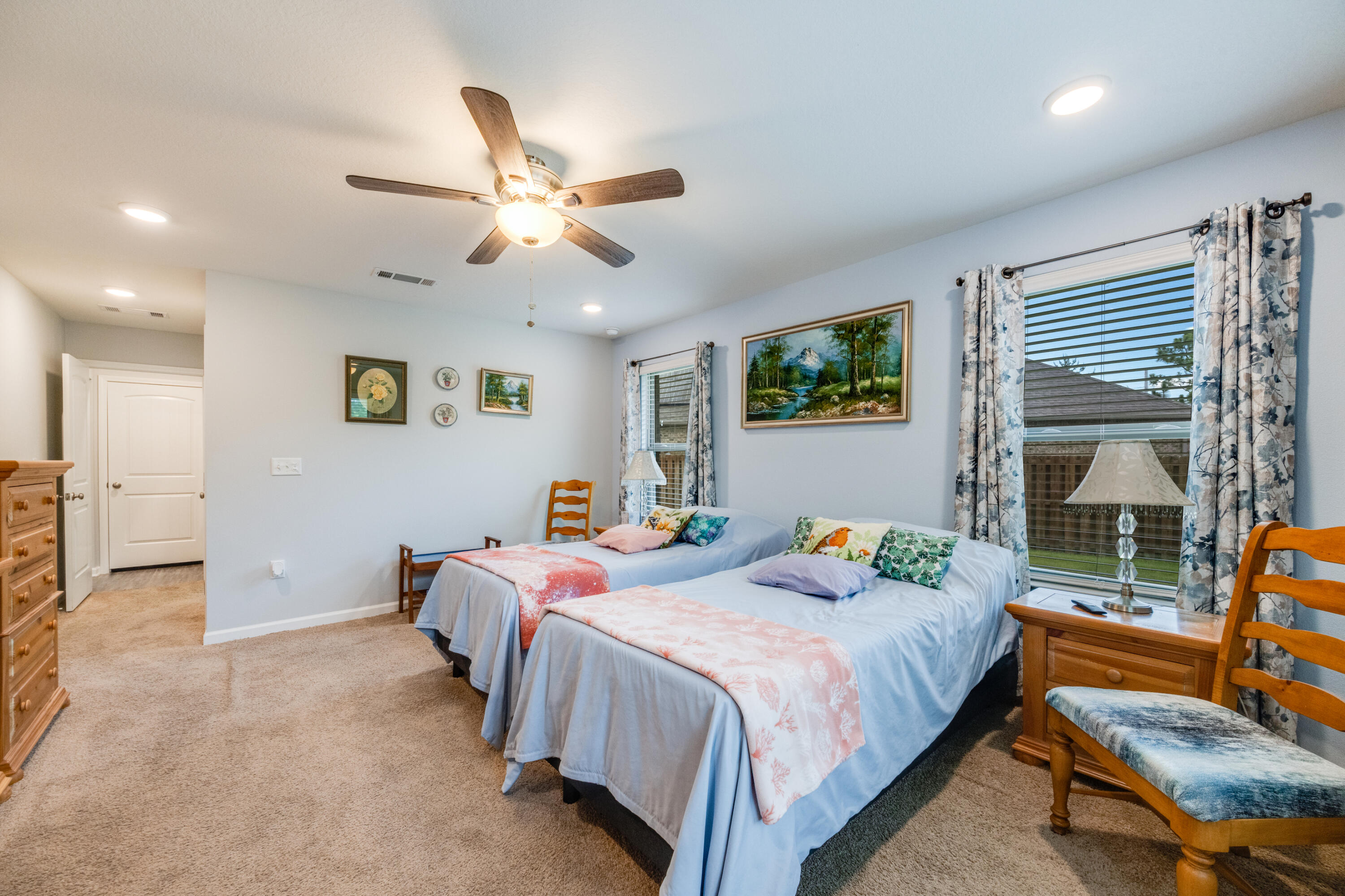 340 Merlin Court Crestview, FL 32539 - Photo 27 of 63 a bedroom with a bed a couch and a window