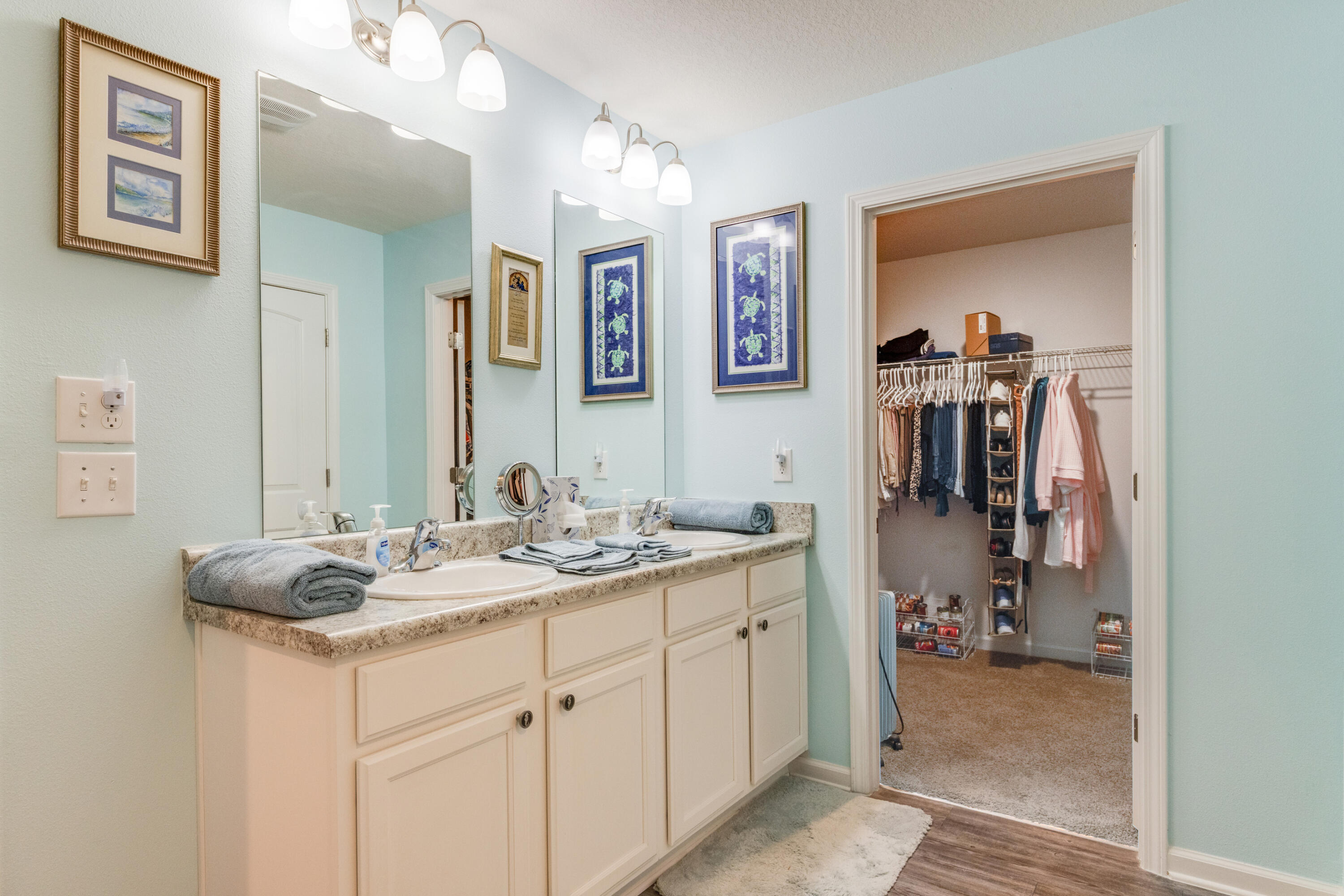340 Merlin Court Crestview, FL 32539 - Photo 29 of 63 a en suite bathroom with a sink and a mirror