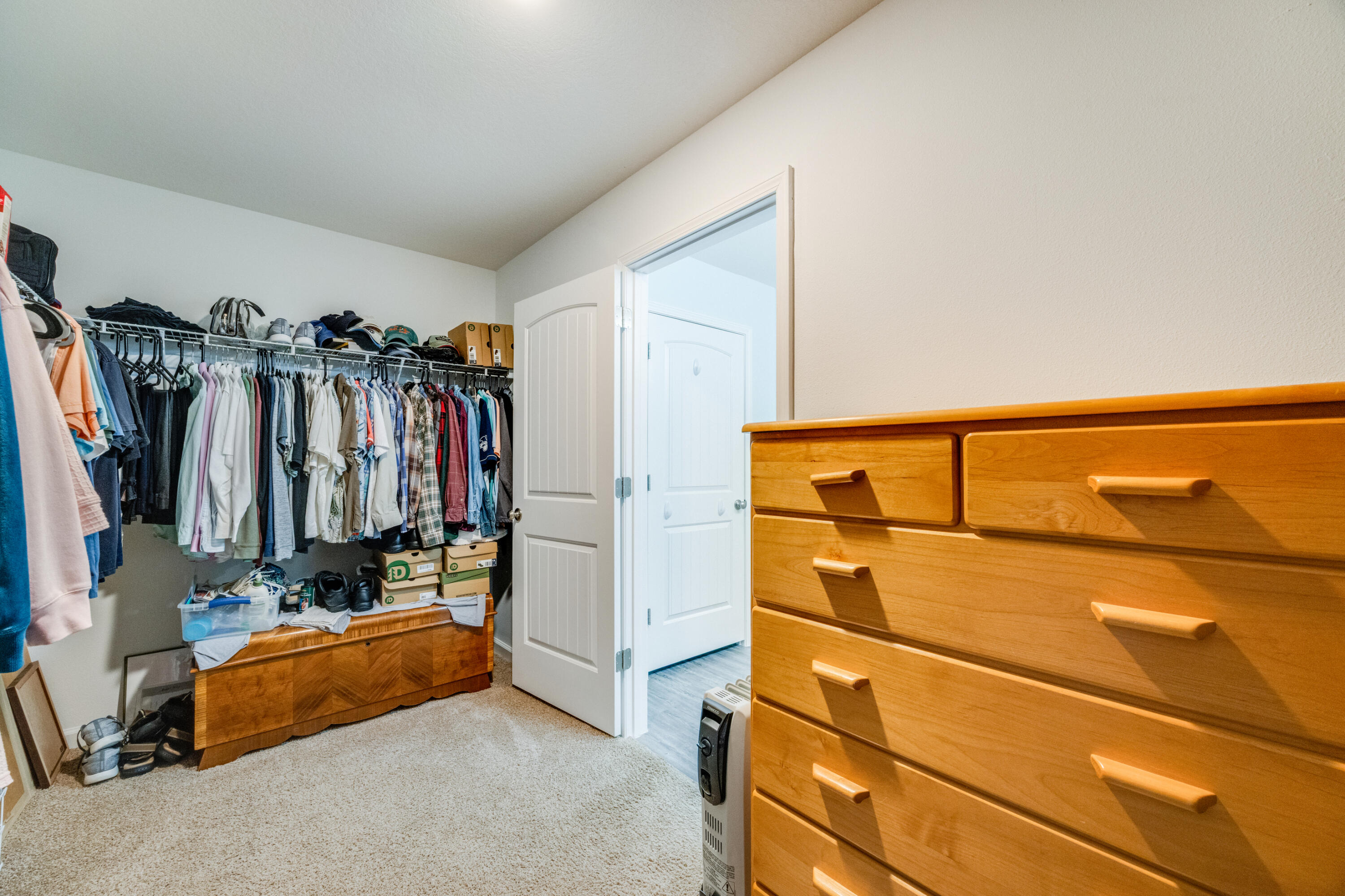 340 Merlin Court Crestview, FL 32539 - Photo 33 of 63 a view of walk in closet with clothes and shoes