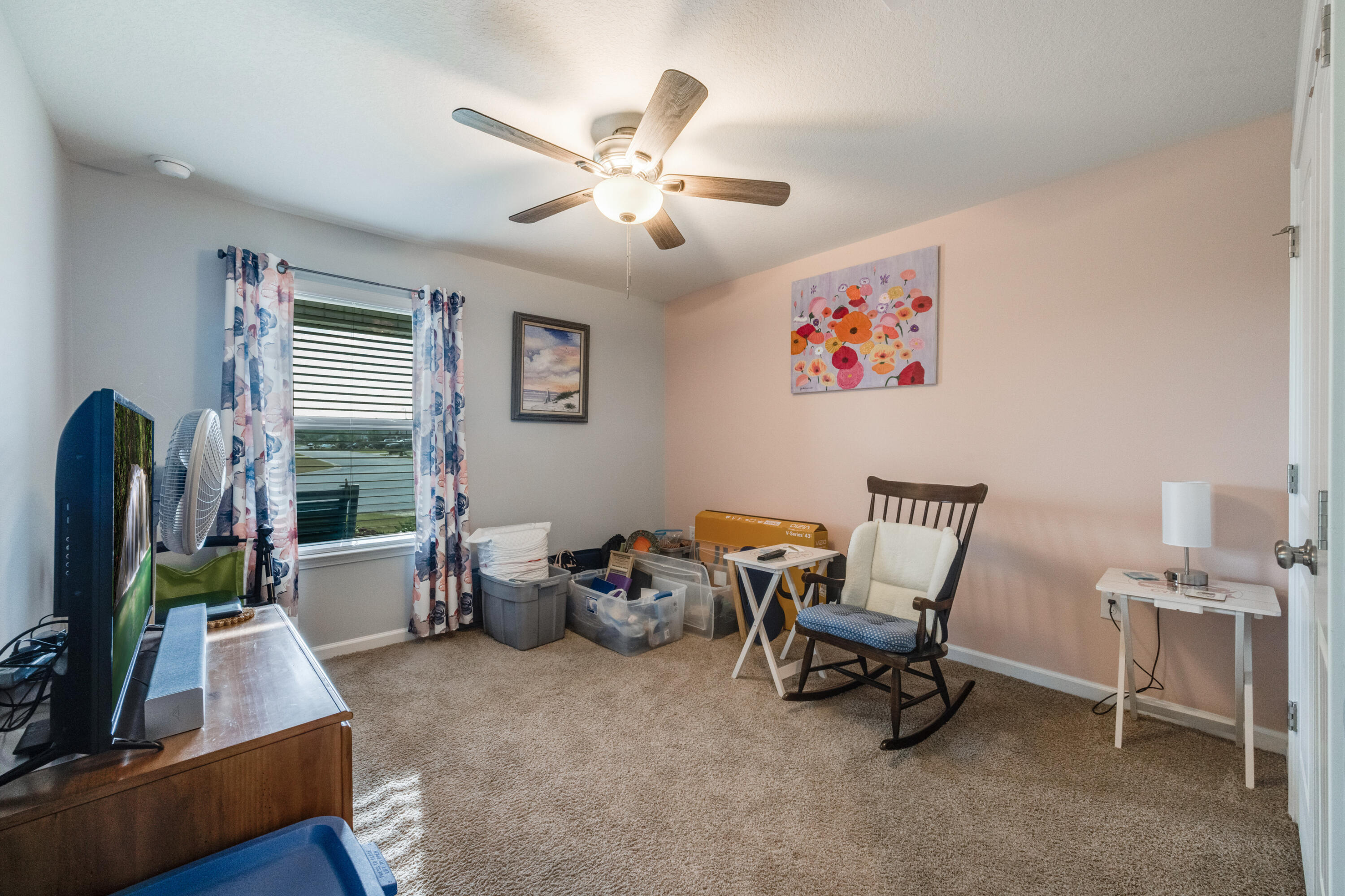 340 Merlin Court Crestview, FL 32539 - Photo 34 of 63 a living room with furniture and a flat screen tv