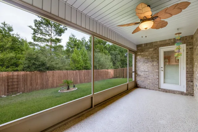 a aerial view of a house with swimming pool garden and patio
