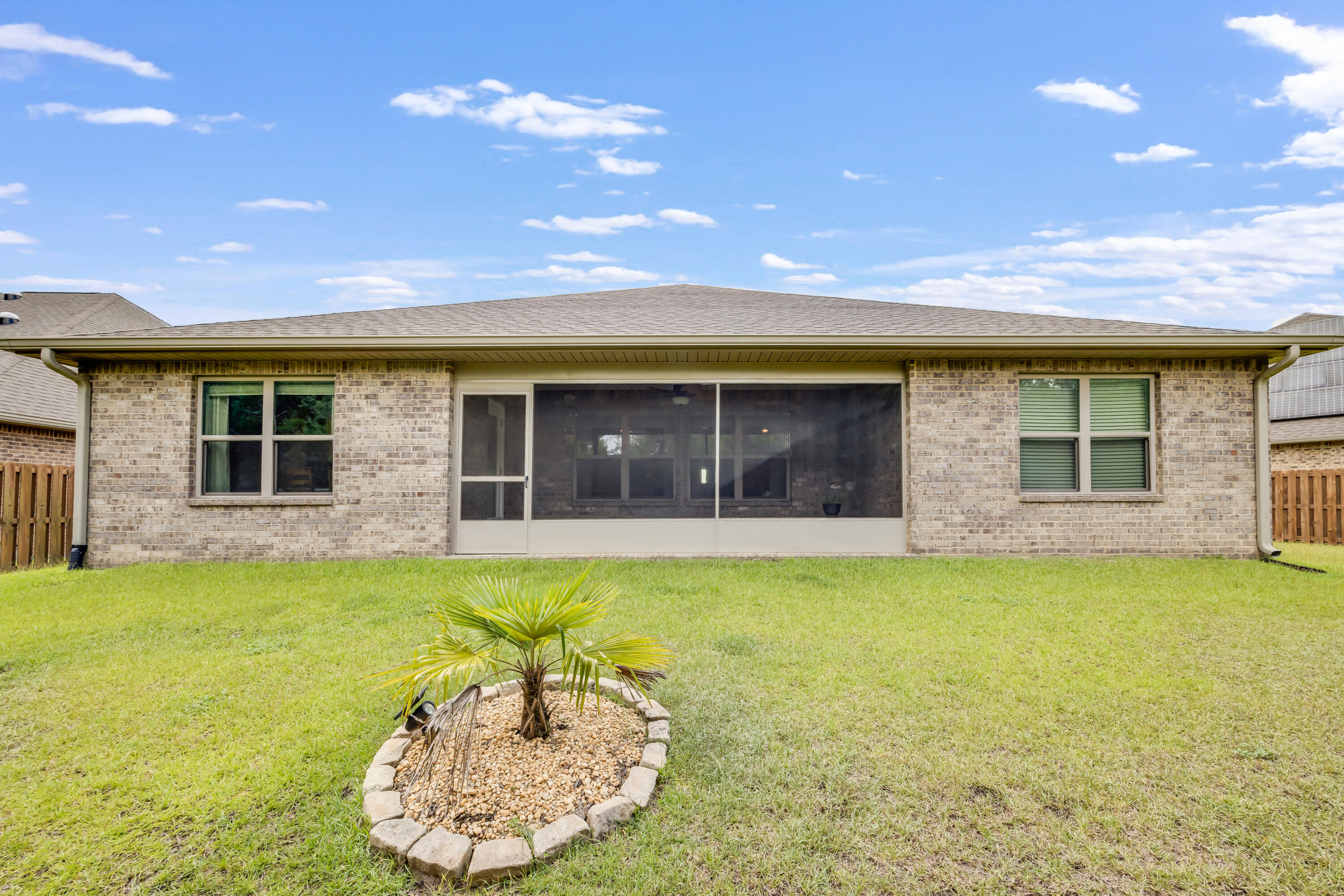 340 Merlin Court Crestview, FL 32539 - Photo 47 of 63 a view of a house with swimming pool and a yard