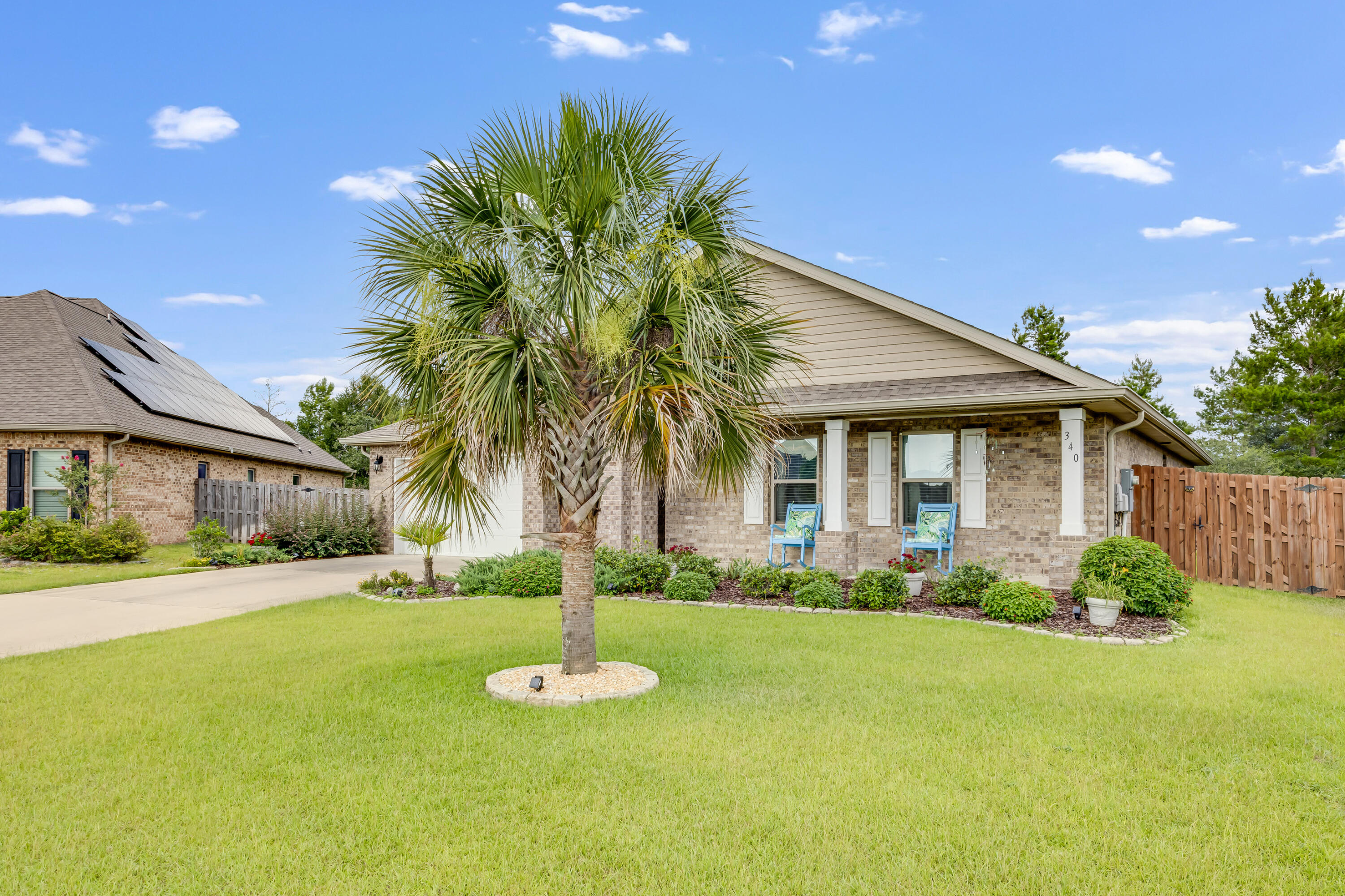 340 Merlin Court Crestview, FL 32539 - Photo 6 of 63 a front view of a house with a yard and potted plants